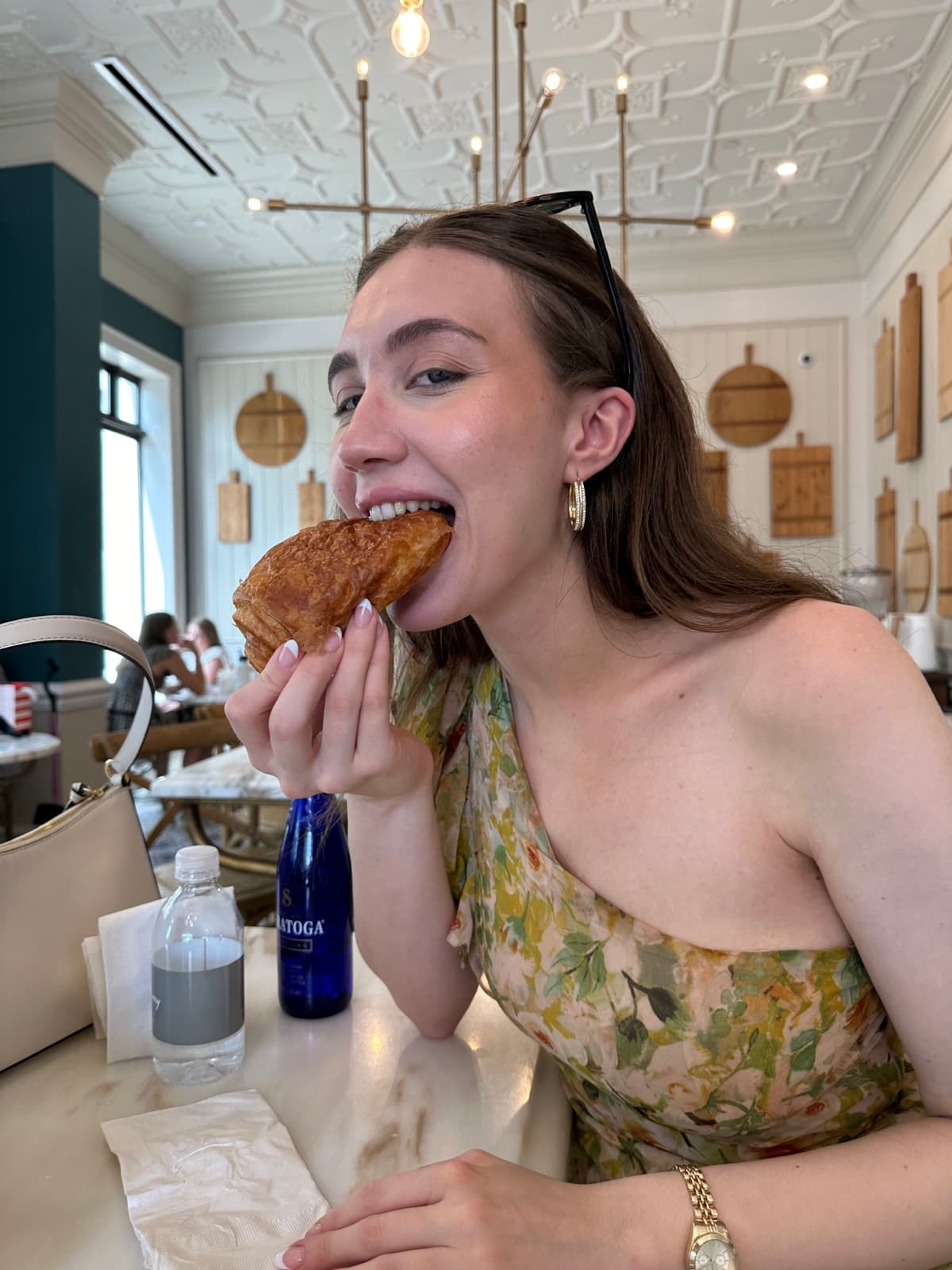 Ajla, founder of The Private Pantry, enjoying a croissant